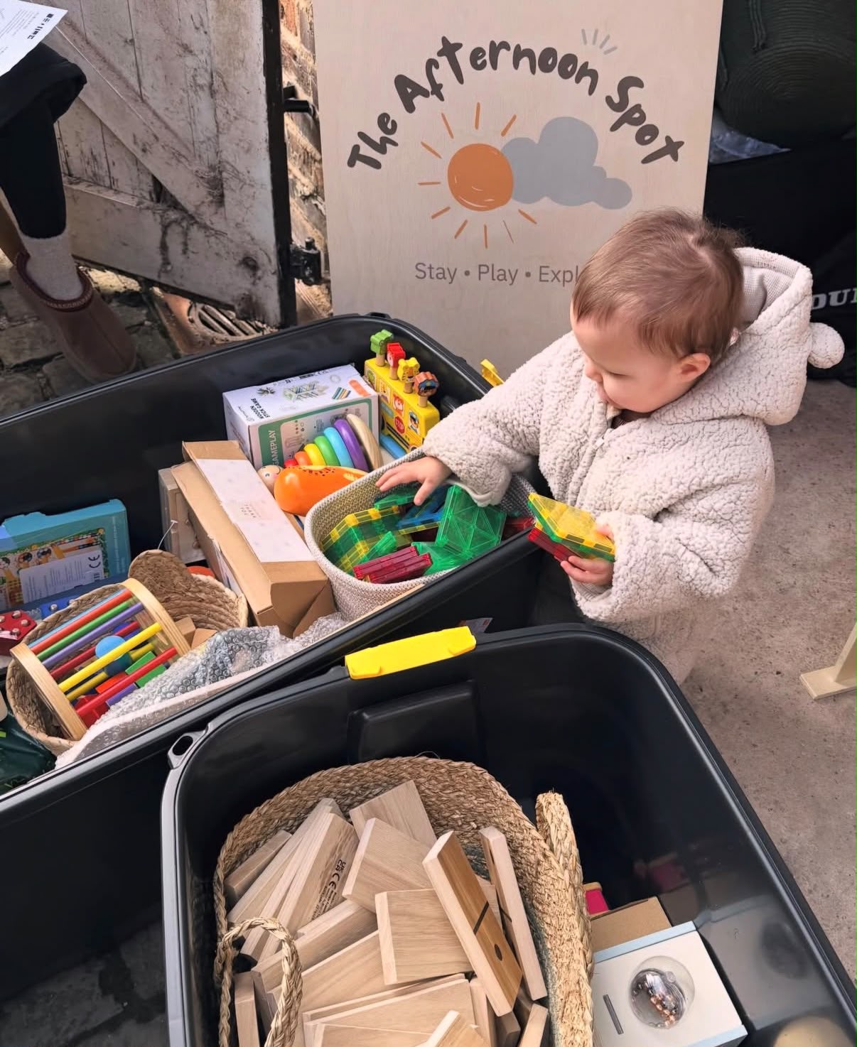 Toddler choosing toys at a The Afternoon Spot session